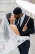 Bride wearing Moon by Maggie Sottero kissing her husband