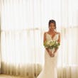 Bride with Bouquet wearing Sexy Boho Mermaid Wedding Dress called Tuscany by Maggie Sottero.