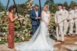 Bride wearing Albany wedding dress by Maggie Sottero at her ceremony