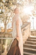 Bride Wearing Glamorous Lace And Sequin Wedding Dress Called Tuscany By Maggie Sottero Showing Back In Sunlight