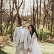 Bride with groom wearing A-line long sleeve lace wedding dress.