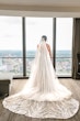 Bride wearing Marvine wedding gown by Sottero and Midgley 