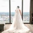 Bride wearing Marvine wedding gown by Sottero and Midgley