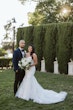 Bride wearing Hattie Lynette wedding dress by Rebecca Ingram with her husband