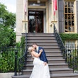 Groom kissing his bride outside the venue. 