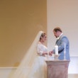 bride with groom wearing off the shoulder A line wedding dress