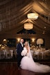 Bride wearing Holden wedding dress by Sottero and Midgley with her husband at their venue