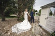 Bride wearing Josie by Rebecca Ingram walking with her husband