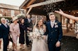 Bride wearing Stevie wedding gown by Maggie Sottero at their exit