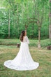 Bride Wearing Dreamy Long Bishop Lace Sleeve Wedding Dress Called Finley By Sottero And Midgley Showing Back Near Forest Arch