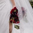 Bride On Beach With Groom In Strapless Wedding Dress Called Monaco By Maggie Sottero