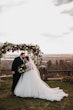 Bride In Lace Ballgown Wedding Dress Called Mallory Dawn By Maggie Sotero With Groom At Floral Alter