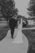 Bride Wearing Simple Fit-and-Flare Wedding Dress Called Fernanda By Maggie Sottero With Groom