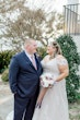 Groom Gazing Lovingly Bride Wearing A-Line Wedding Dress Called Wallis by Maggie Sottero