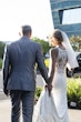 Bride wearing Audrina by Maggie Sottero walking with her husband