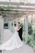 Bride Wearing Off-The-Shoulder A-Line Wedding Dress Called Coral By Rebecca Ingram With Groom