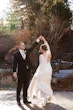 Bride Wearing Boho Sleeved Wedding Dress Called Drita By Maggie Sottero Dancing With Groom