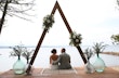 Bride Wearing Simple Chiffon Wedding Dress Called Marta Lynette By Rebecca Ingram With Groom Under Triangle Arch