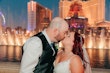 Groom and Bride at a Las Vegas Wedding Wearing Lace Ballgown Called Ellen by Rebecca Ingram