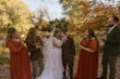 Bride With Bride Wearing Asymmetrical Wedding Gown Winona By Rebecca Ingram