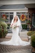 Winter Bride Wearing Vintage Sheath Wedding Dress With Lace and Pearls Called Delilah By Maggie Sottero