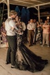 Bride Wearing Black Fit And Flare Wedding Dress Called Zander Lane By Sottero And Midgley Dancing With Groom At The Reception