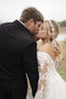 Bride In Off The Shoulder Lace Wedding Dress Called Tiffany By Maggie Sottero With Groom 