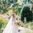 Bride Wearing Sexy Lace Wedding Dress Called Lennon By Maggie Sottero Walking Through A Garden