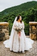 Bride Wearing Shimmery Princess Bridal Gown Called Tiffany By Maggie Sottero Hold Flower Bouquet