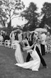 Bride wearing Clover by Rebecca Ingram kissing her husband after their ceremony