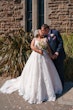 Groom With Bride Wearing Ball Gown Trinity By Maggie Sottero