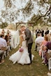 Bride Wearing Pink Lace Mermaid Wedding Dress Called Kenleigh By Sottero And Midgley Kissing Groom After The Ceremony