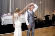 Bride wearing Audrina by Maggie Sottero dancing with her husband