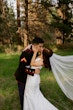 Bride wearing Hilo by Maggie Sottero kissing her husband