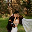 Bride wearing Hilo by Maggie Sottero kissing her husband