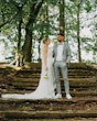 Bride wearing Fontaine by Maggie Sottero looking at her husband