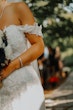 Bride wearing Marguerite wedding dress by Maggie Sottero