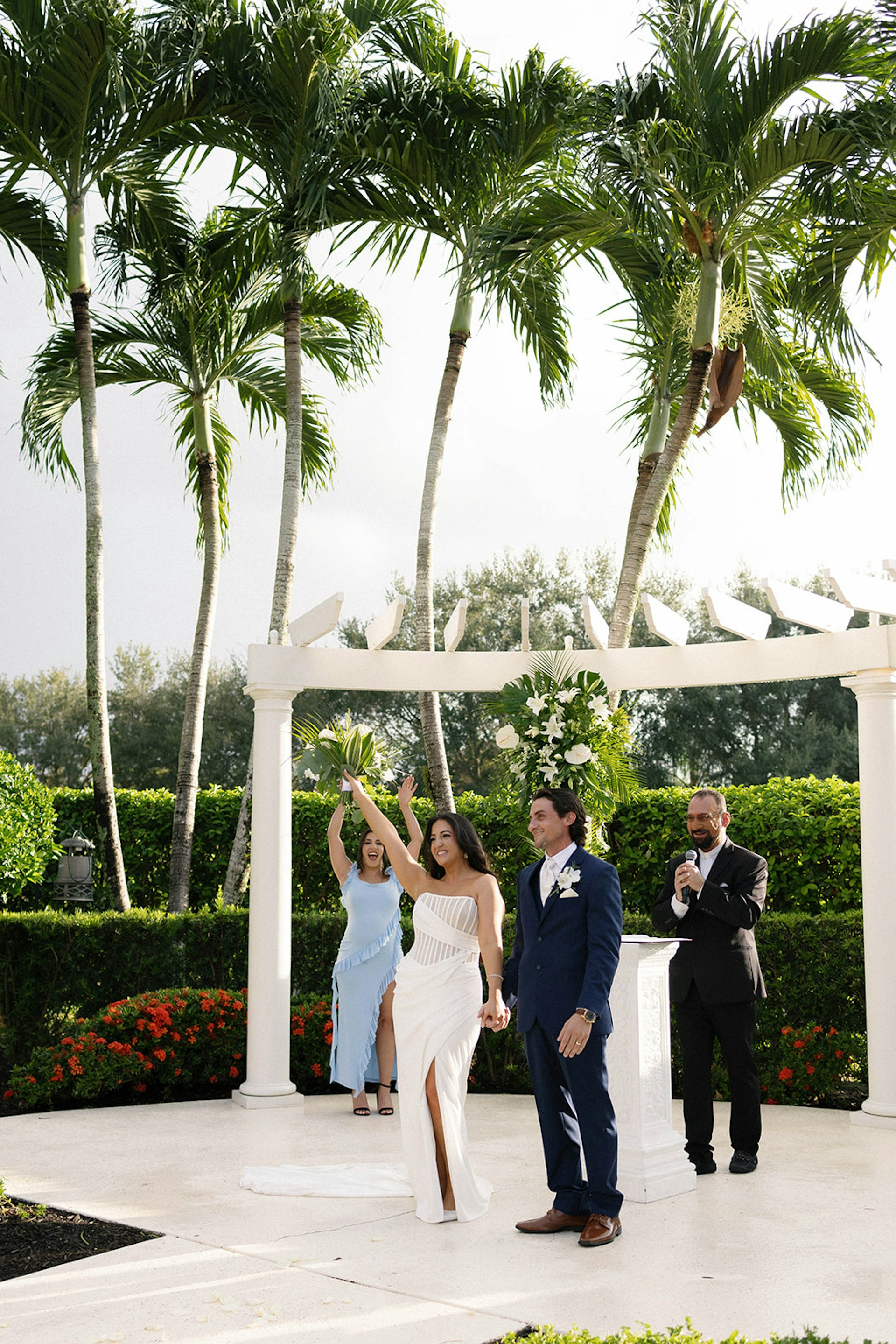 Bride Wearing Grecian Inspired Wedding Dress Called Gabrielle By Maggie Sottero Holding Hands With Groom