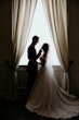 Bride wearing Anniston by Maggie Sottero with her husband