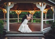 Bride wearing Fiona by Maggie Sottero kissing her husband