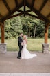 Bride wearing Hattie Lynette by Rebecca Ingram and her husband