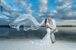 Bride In Off The Shoulder Lace Wedding Dress Called Edison By Maggie Sottero With Groom