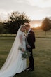 Bride wearing Yates wedding dress by Maggie Sottero with her husband