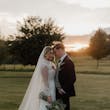 Bride wearing Yates wedding dress by Maggie Sottero with her husband