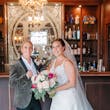 Bride wearing Johanna by Maggie Sottero at the bar with her partner