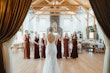 Bride wearing Albany wedding dress by Maggie Sottero with her bridesmaids