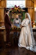 Bride wearing Juniper wedding dress by Sottero and Midgley during their ceremony