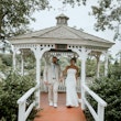 Bride wearing Damiana by Sottero and Midgley walking out of a gazeebo