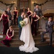 Bride wearing Seneca wedding dress by Sottero and Midgley surrounded by bridal party