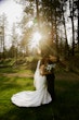 Bride wearing Hilo by Maggie Sottero touching foreheads with her husband